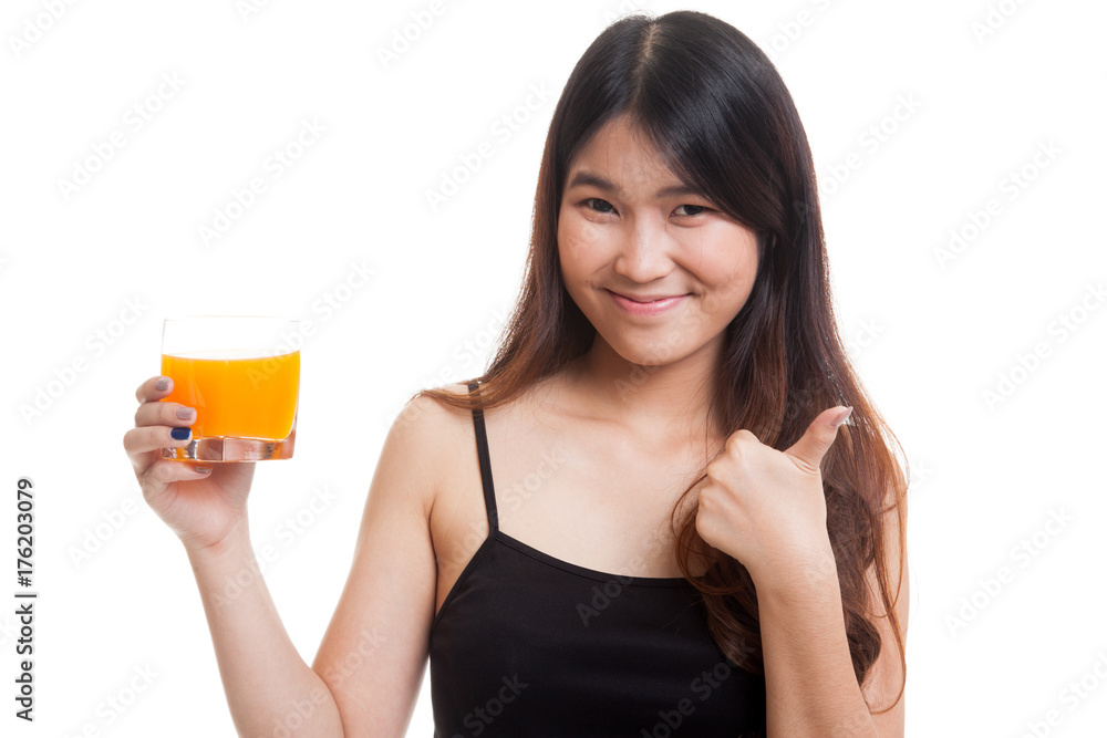 Young Asian woman thumbs up drink orange juice. Young Asian woman thumbs up drink orange juice.