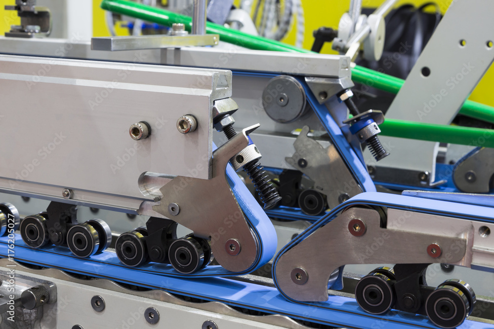 © warut - detail of a folder gluer machine