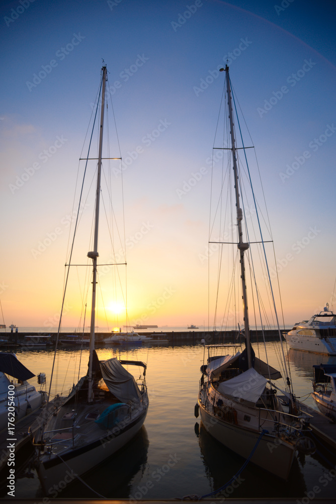 Morning view at the boat docked area with sunrise sky background