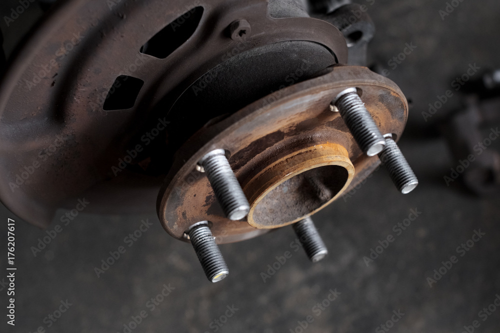 Close up of old hub wheel car. Rust on hub wheel. Front wheel. Close up of old hub wheel car. Rust on hub wheel. Front wheel.