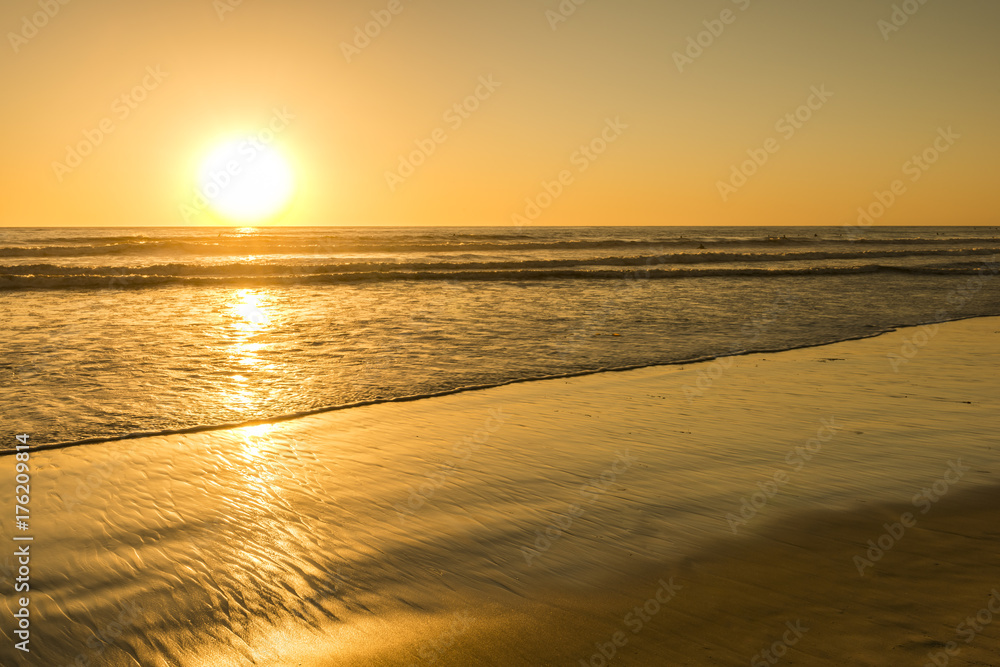 The bright sun of California. Sunset bright sun sets over the horizon. Beautiful beaches of California. South of the USA