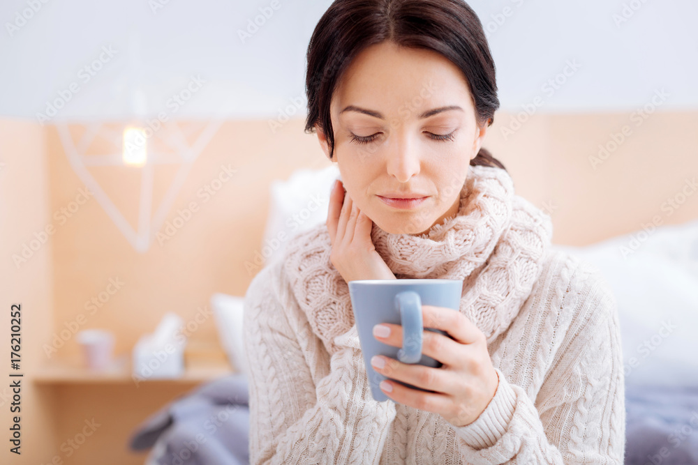 Sad woman having a terrible sore throat Sad woman having a terrible sore throat