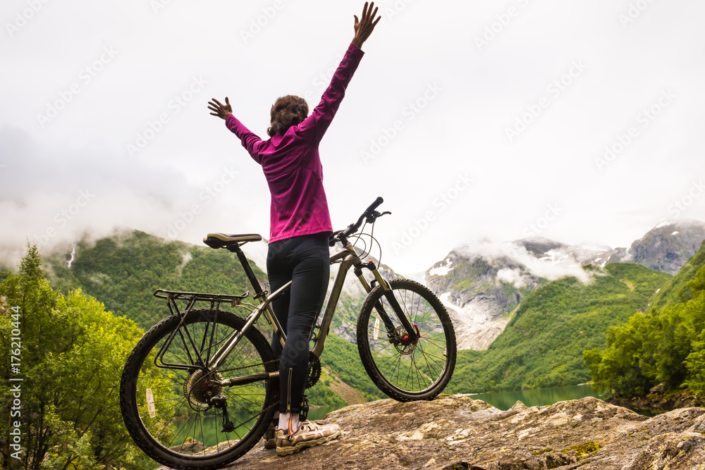 Biking in Norway against picturesque landscape Biking in Norway against picturesque landscape