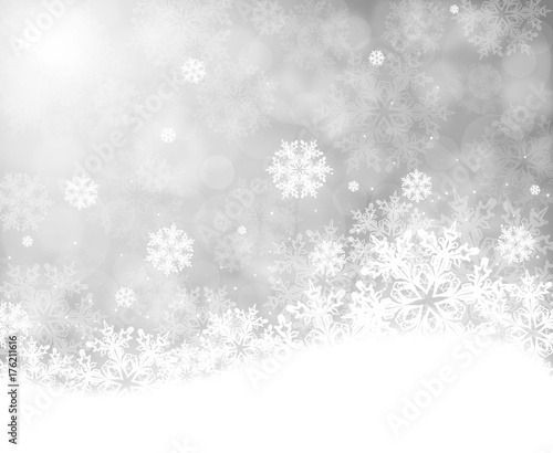 Christmas background with snowflakes on grey bokeh