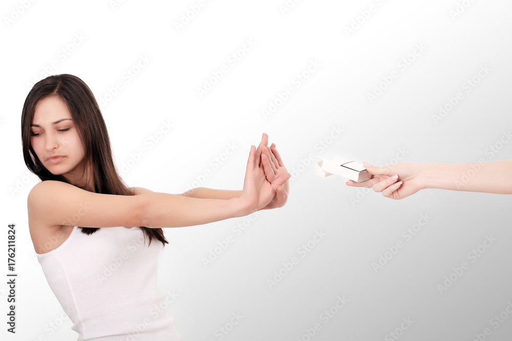 Healthy Young Woman Refusing To Take Cigarette From Pack. Portrait Of Beautiful Female Showing Stop Sign With Hand To Cigarettes. Quit Smoking Concept. High Resolution Healthy Young Woman Refusing To Take Cigarette From Pack. Portrait Of Beautiful Female Showing Stop Sign With Hand To Cigarettes. Quit Smoking Concept. High Resolution