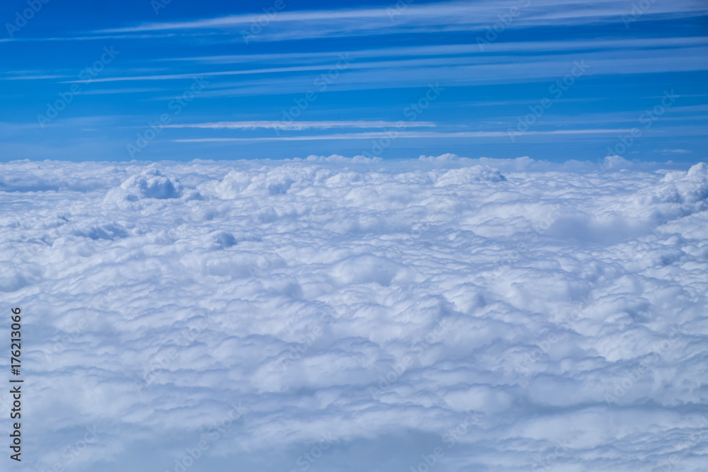 Cloud texture and blue sky view from airplane.