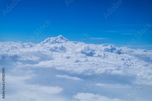 Cloud texture and blue sky view from airplane. © NewSaetiew