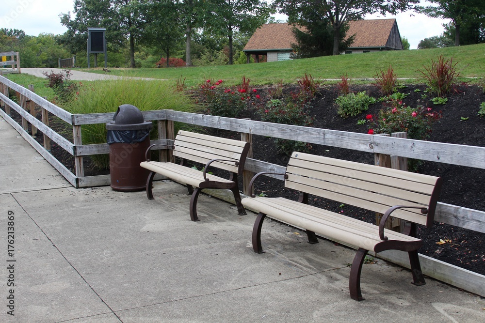 The empty park benches in the garden of the park.