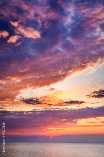 Wonderful sunset over calm sea in summer