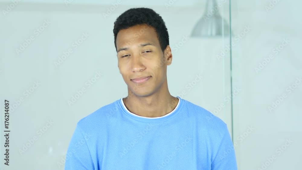 Portrait of Positive Afro-American Man Looking in Camera Portrait of Positive Afro-American Man Looking in Camera