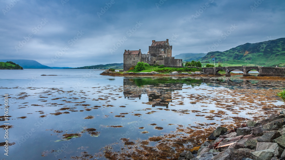 Cold sunset over lake at Eilean Donan Castle in Scotland