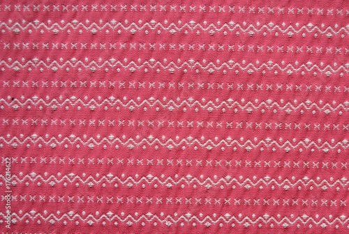 Tekstura tkaniny z misternym haftem