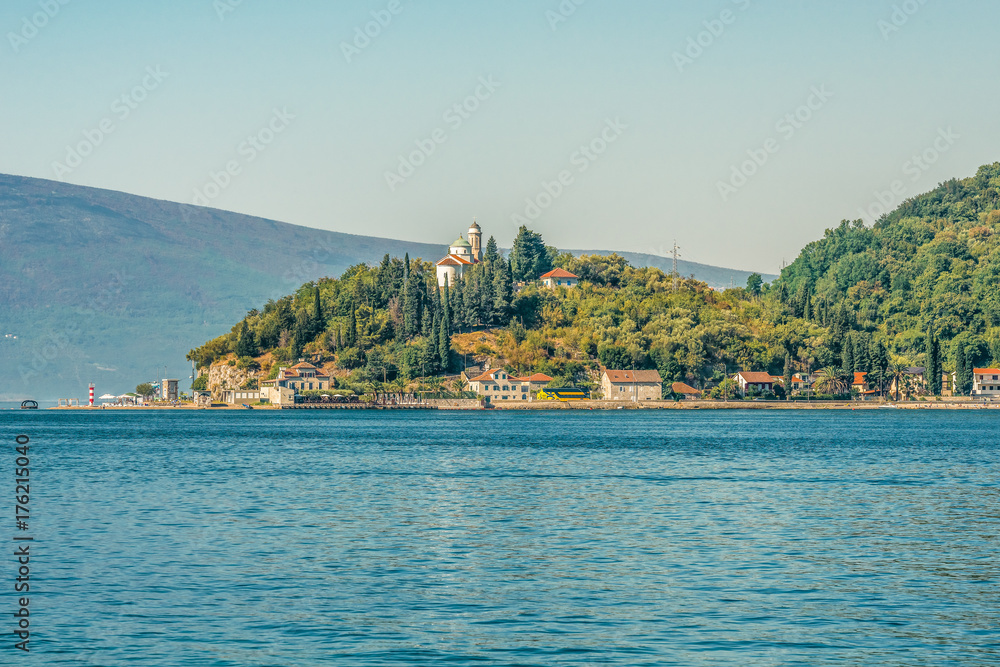 Naklejka premium An ancient temple of the covering of the Virgin on the coast of the Bay of Kotor.