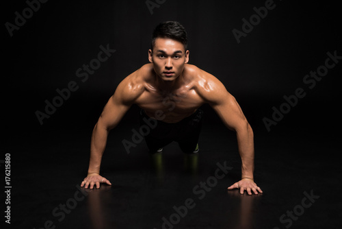 athletic man doing push ups