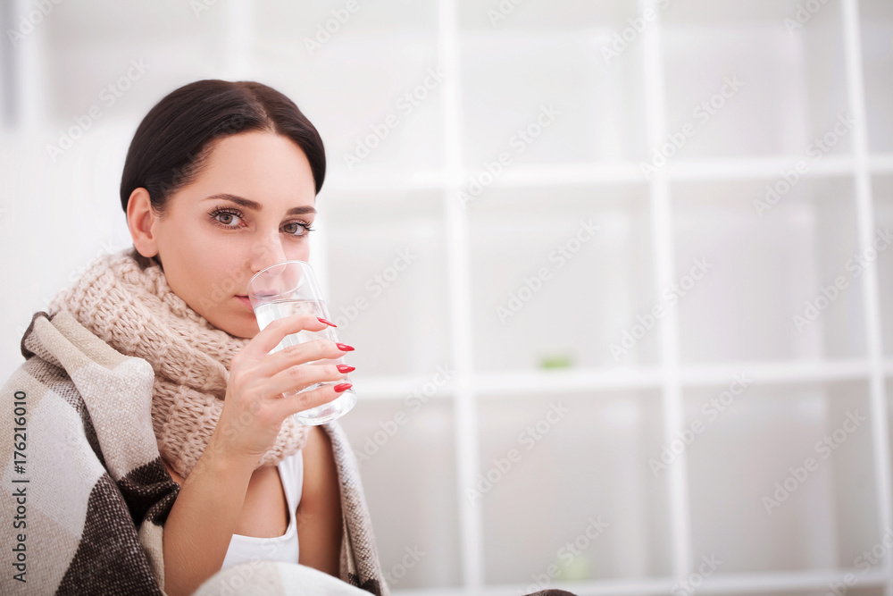 Flu. Young woman with cold / flu lying on the bed
