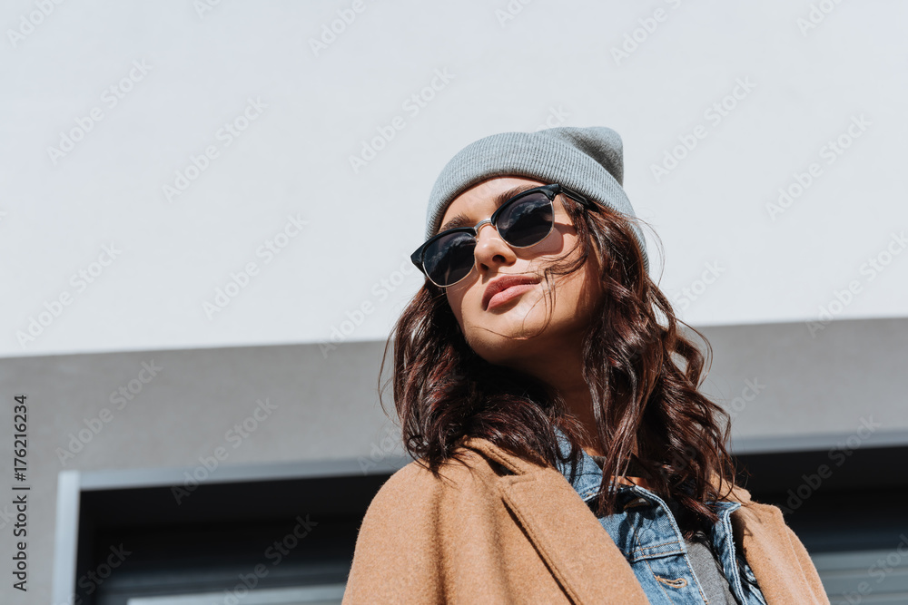Fototapeta premium Woman in autumn outfit and black sunglasses