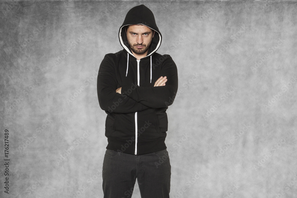 The hooligan, dressed in black, is very confident The hooligan, dressed in black, is very confident
