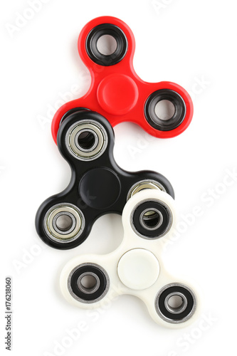 Colourful fidget spinner toys isolated on white