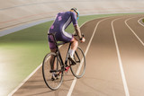 cyclist riding bicycle on cycle race track