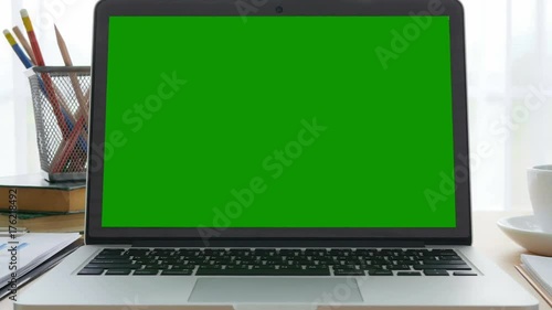 4K : A laptop computer with a key green screen. photo