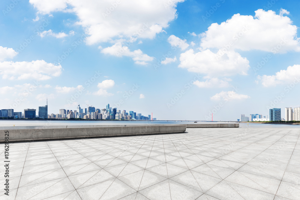 empty marble floor with cityscape of modern city