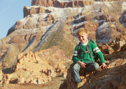 travel concept - little boy enjoy hiking in mountains