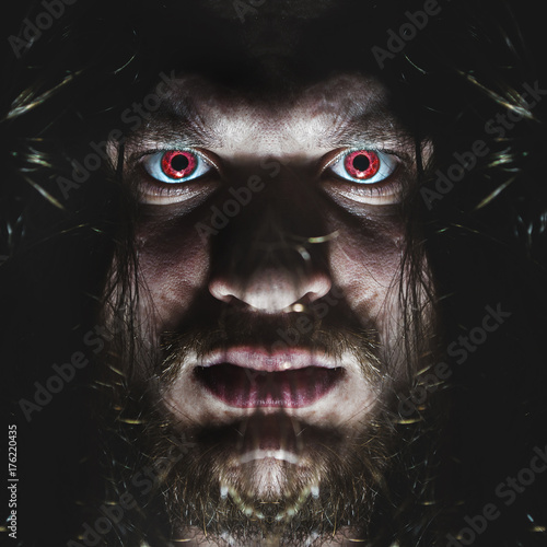 Obraz na płótnie Portrait of a man with a red eye for horror or halloween. w salonie