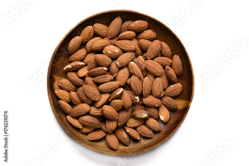 Top view dried almond in wood bowl on white background.