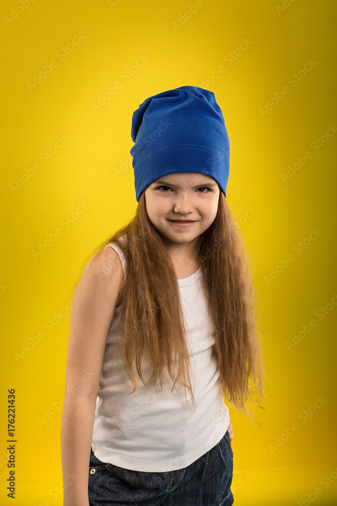 Beautiful caucasian girl posing in studio on a Yellow isolated background Beautiful caucasian girl posing in studio on a Yellow isolated background