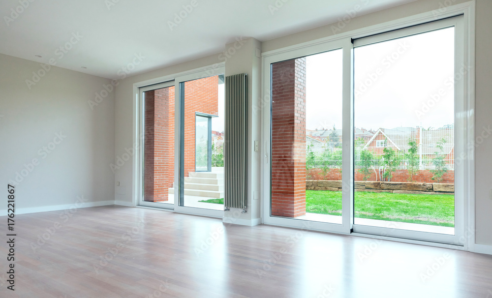 Large living room with large windows overlooking the garden Large living room with large windows overlooking the garden
