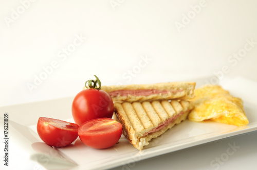 Scrambled eggs and toasts. Selective focus with turkish tea