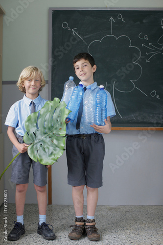 School boys giving science presentation photo