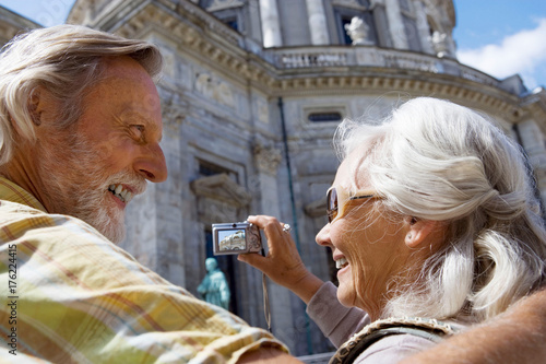 Photography Couple taking picture of church