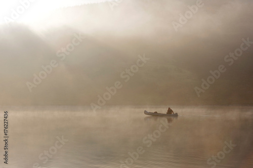 Kayaking in the morning mist.