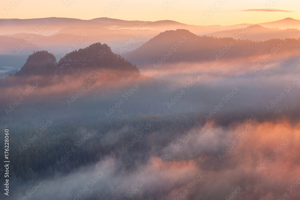 sunrise from foggy Kleiner Winterberg in the national park Saxon Switzerland, Germany