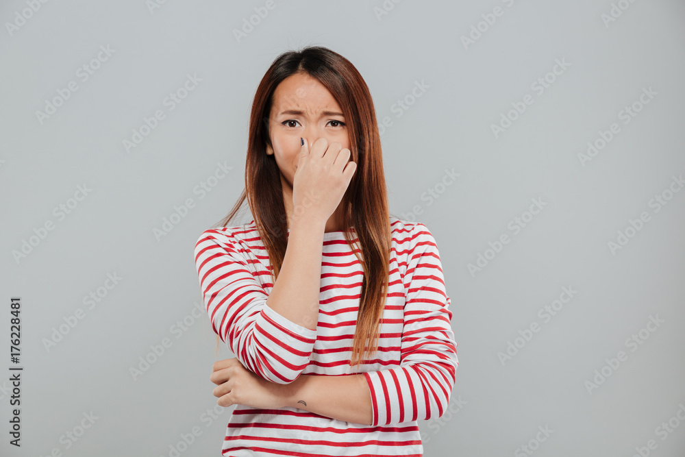 Portrait of a an upset disappointed asian woman crying Portrait of a an upset disappointed asian woman crying