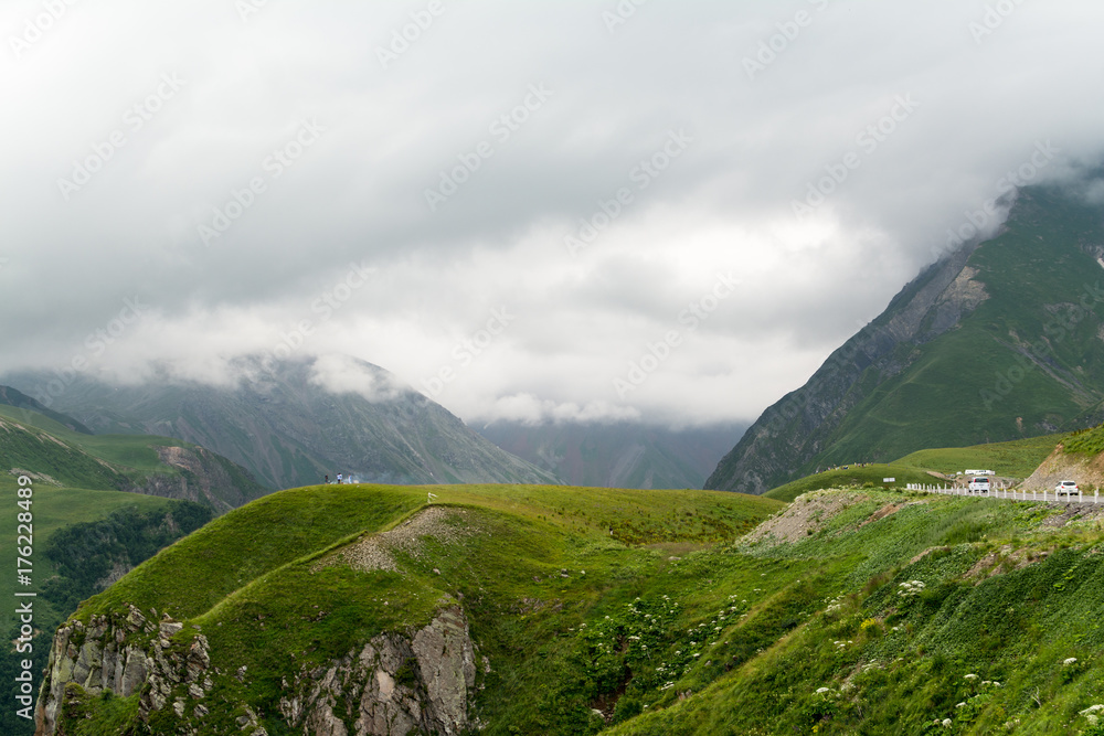 Cloudy high mountain peaks in Caucasus, view from Georgian Military Road