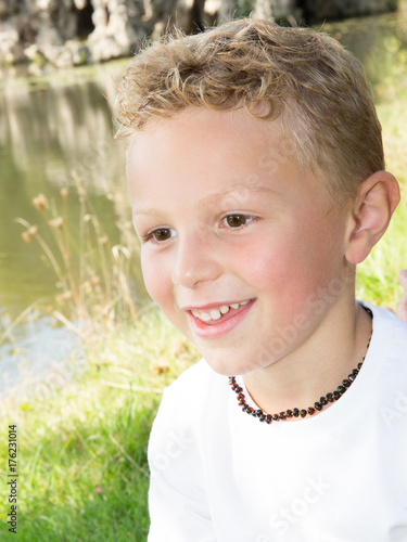 Portrait of a cute young boy outside