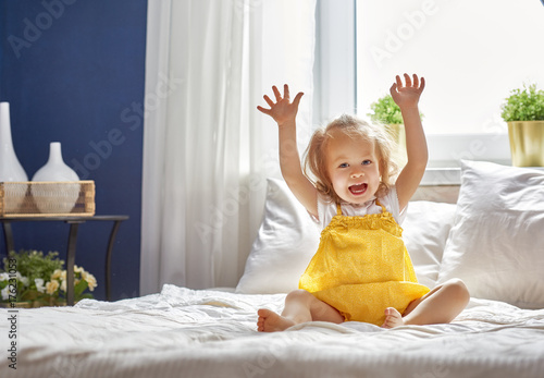 Wallpaper Mural baby girl on the bed Torontodigital.ca