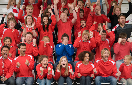 Fan amongst rivals at football match