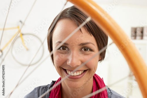 happy woman in bikestore photo