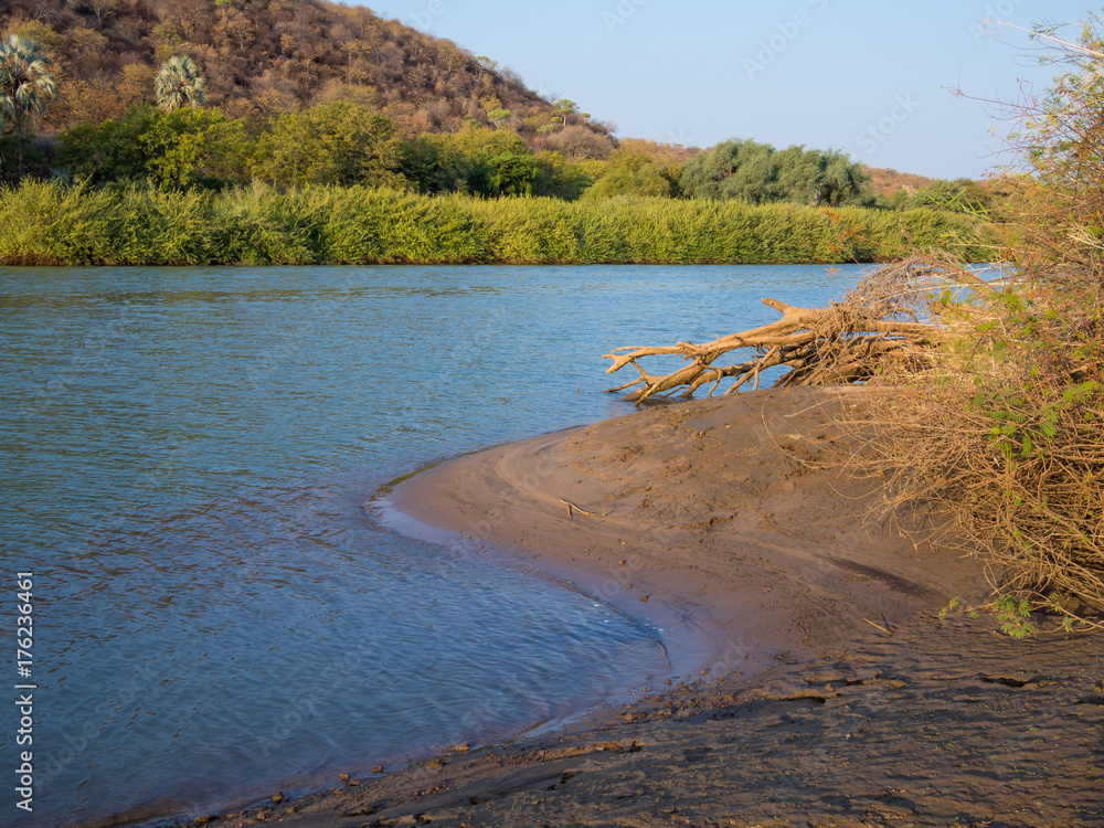 Landscape view over beautiful Kunene River which seperates Namibia and Angola, Southern Africa