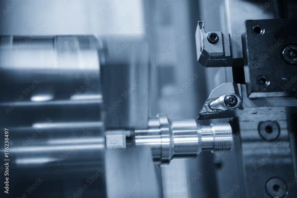 CNC lathe machine (Turning machine) cutting the metal screw thread part by lathe cutter .Hi-precision CNC machining concept. CNC lathe machine (Turning machine) cutting the metal screw thread part by lathe cutter .Hi-precision CNC machining concept.
