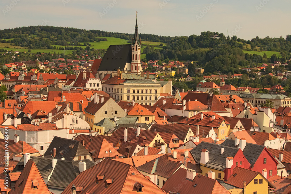 Red tile roofs cityscape. Church of Saint Vitus- UNESCO World Heritage Site. Summer sunny day. Cesky Krumlov (Krumau), Czech Republic.