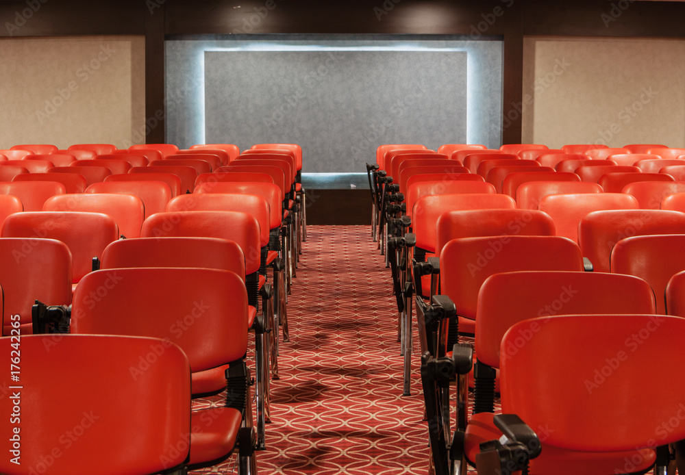 Fototapeta premium rows of red chairs in empty conference hall