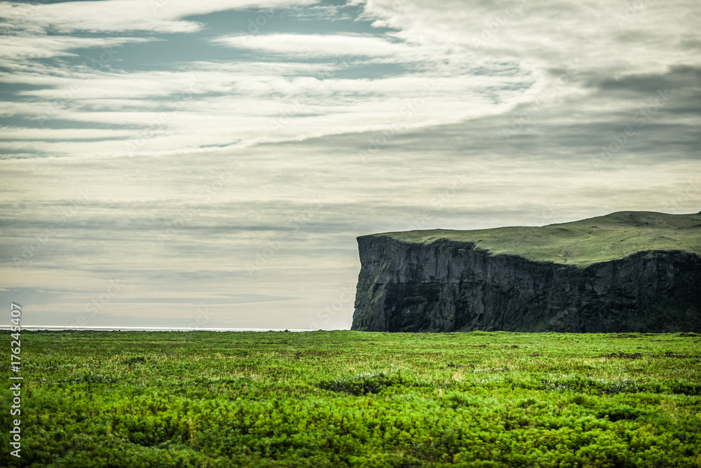 Icelandic landscapes in the Vik area. Endless spaces, green and mountain.