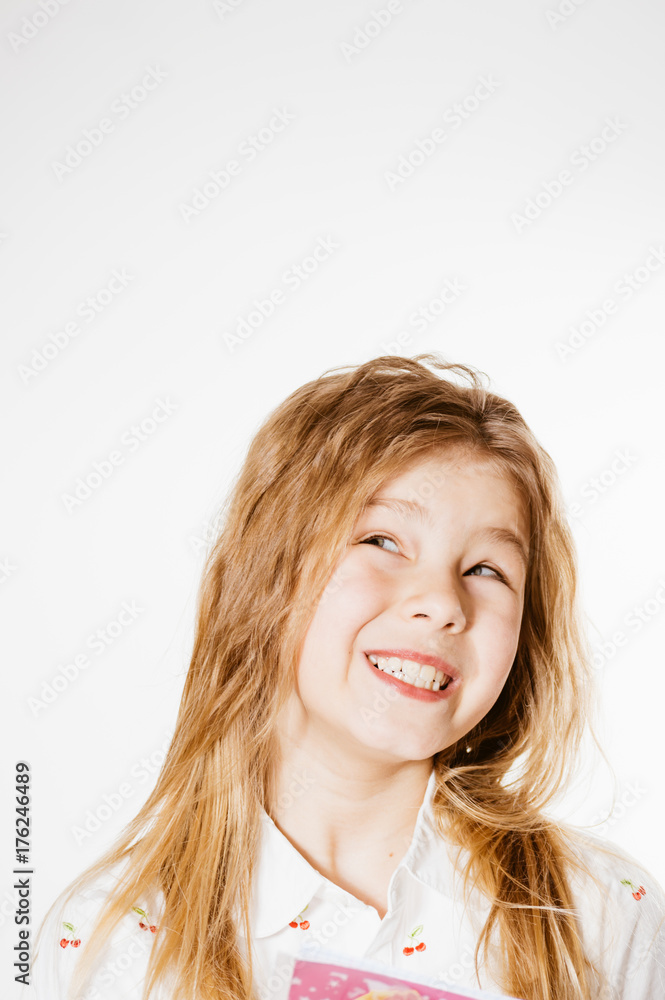 Joyful exciting girl on a light background, closeup portrait Joyful exciting girl on a light background, closeup portrait