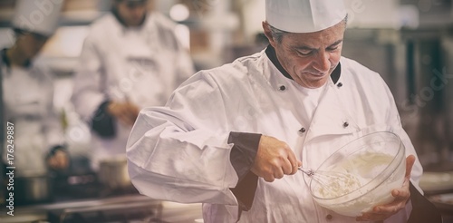 Photography Happy chef whisking cream