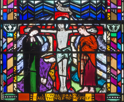 LONDON  GREAT BRITAIN - SEPTEMBER 16  2017  The stained glass of Crucifixion in church St Etheldreda by Charles Blakeman  1953 - 1953 .