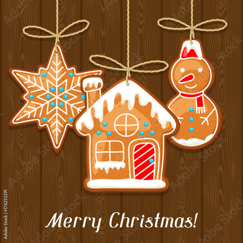 Merry Christmas greeting card with hanging gingerbread